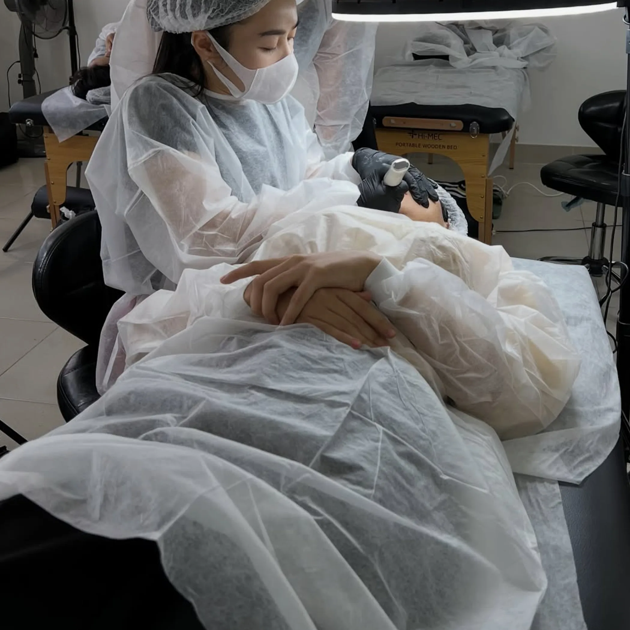 professional applying permanent eyeliner safely