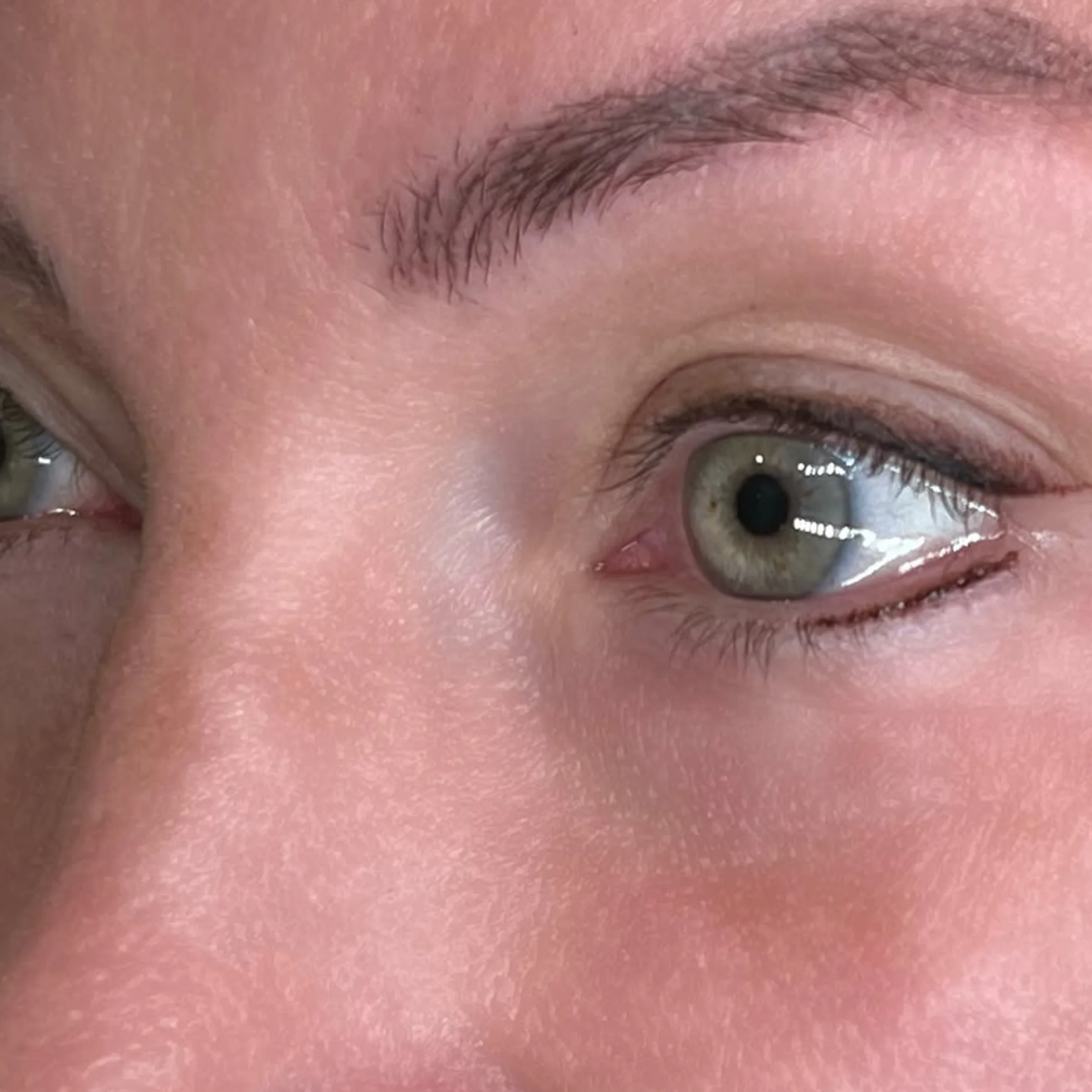 close-up of permanent eyeliner application